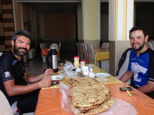 Reza and Steven enjoy local cuisine and a few moments off the bike.